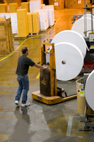 Moving large rolls of paper to convert to envelopes